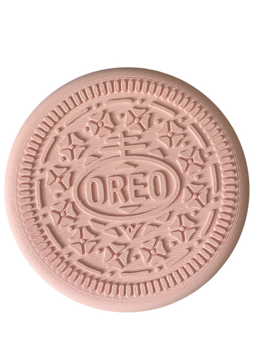 "Unique Realistic Oreo-Shaped Coasters in Light Pink and Black"