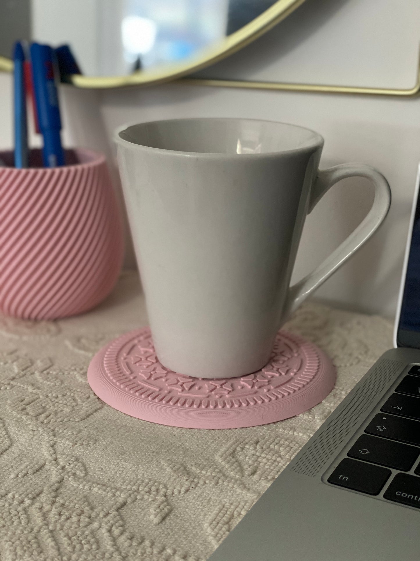 "Unique Realistic Oreo-Shaped Coasters in Light Pink and Black"
